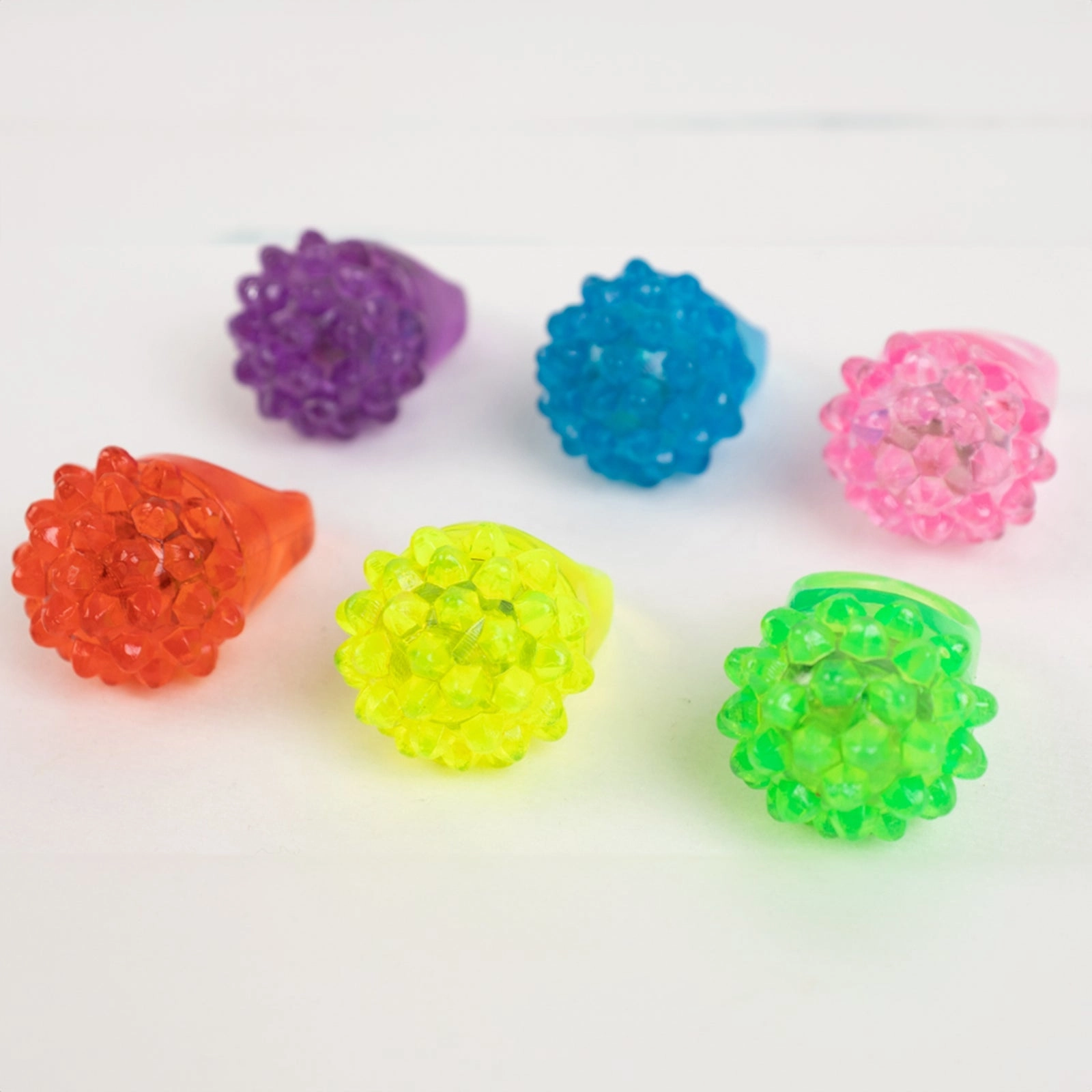 24 Pack Rubber LED Light-Up Rings, Flashing Jelly Finger Toys with 3 Flashing Modes for Party Favors, Halloween, Raves, and Concerts